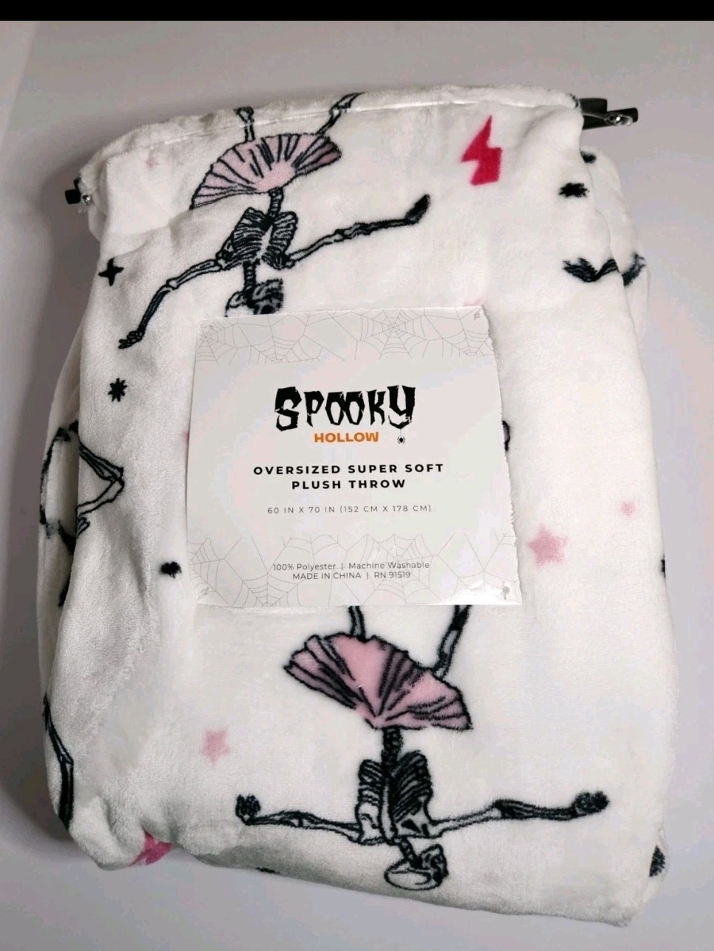 Spooky Hollow Halloween Plush Throw Blanket in White with Dancing Skeletons